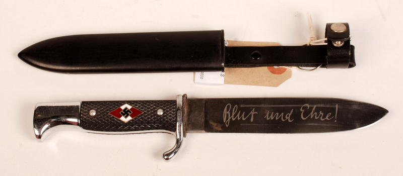 A Hitler Youth knife, the handle enamelled with swastikas, the blade engraved and with its