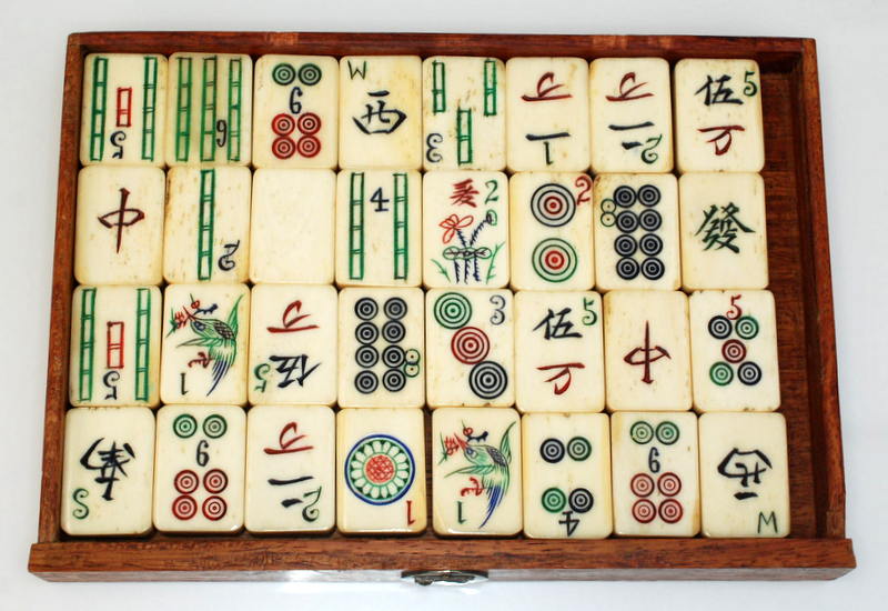 A Mahjong set in a hardwood case with a sliding front opening onto five drawers. Condition Report: - Image 2 of 5