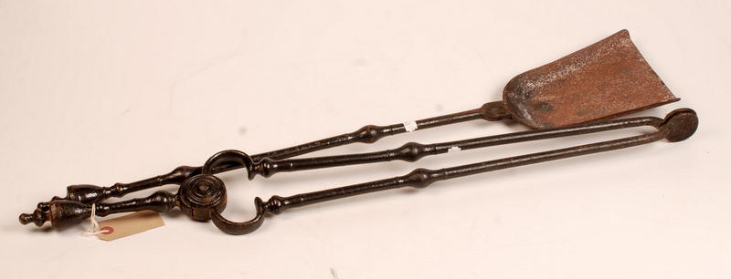 A pair of iron coal tongs and a coal sho