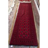 An Afghan long rug, 276 x 76cm.