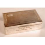 A George VI silver cigarette box of rect