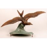 An Art Deco cast metal model of a bird i