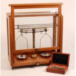 A laboratory balance and a box of weight