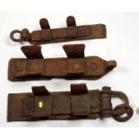 Three wrought iron cart brake shoes.