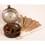 A 19th century circular tin spice box wi