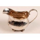 A George III oval belied silver jug with