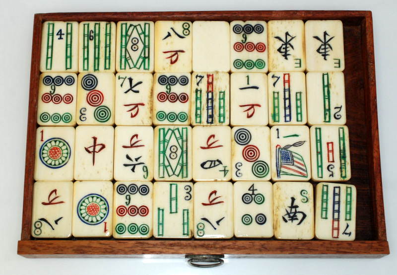 A Mahjong set in a hardwood case with a sliding front opening onto five drawers. Condition Report: - Image 5 of 5