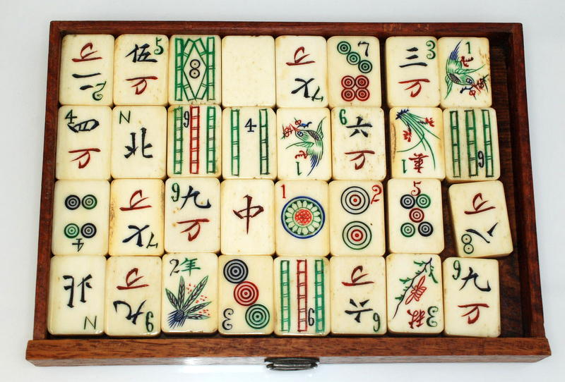 A Mahjong set in a hardwood case with a sliding front opening onto five drawers. Condition Report: - Image 3 of 5