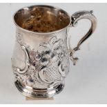 A George III silver bellied mug embossed