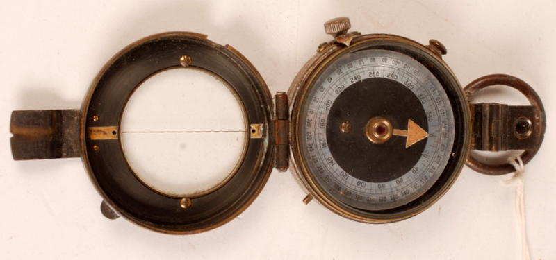 A military brass prismatic field compass