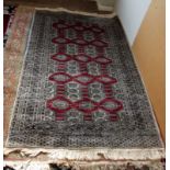 A Turkoman style, red ground rug, 125 x