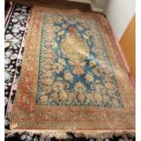 A Kashan blue ground, tendril filled rug with central medallion, 140 x 220cm. Condition Report: