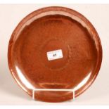 A Newlyn copper circular planished dish,