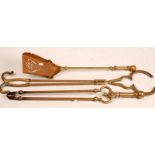 Three brass fire implements.