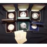 Six proof silver coins, each cased.