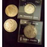 Three Morgan dollars, 1880, 1883 and 192