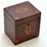 A small Georgian mahogany tea caddy with satin wood inlaid ovals and corners, height 12cm.