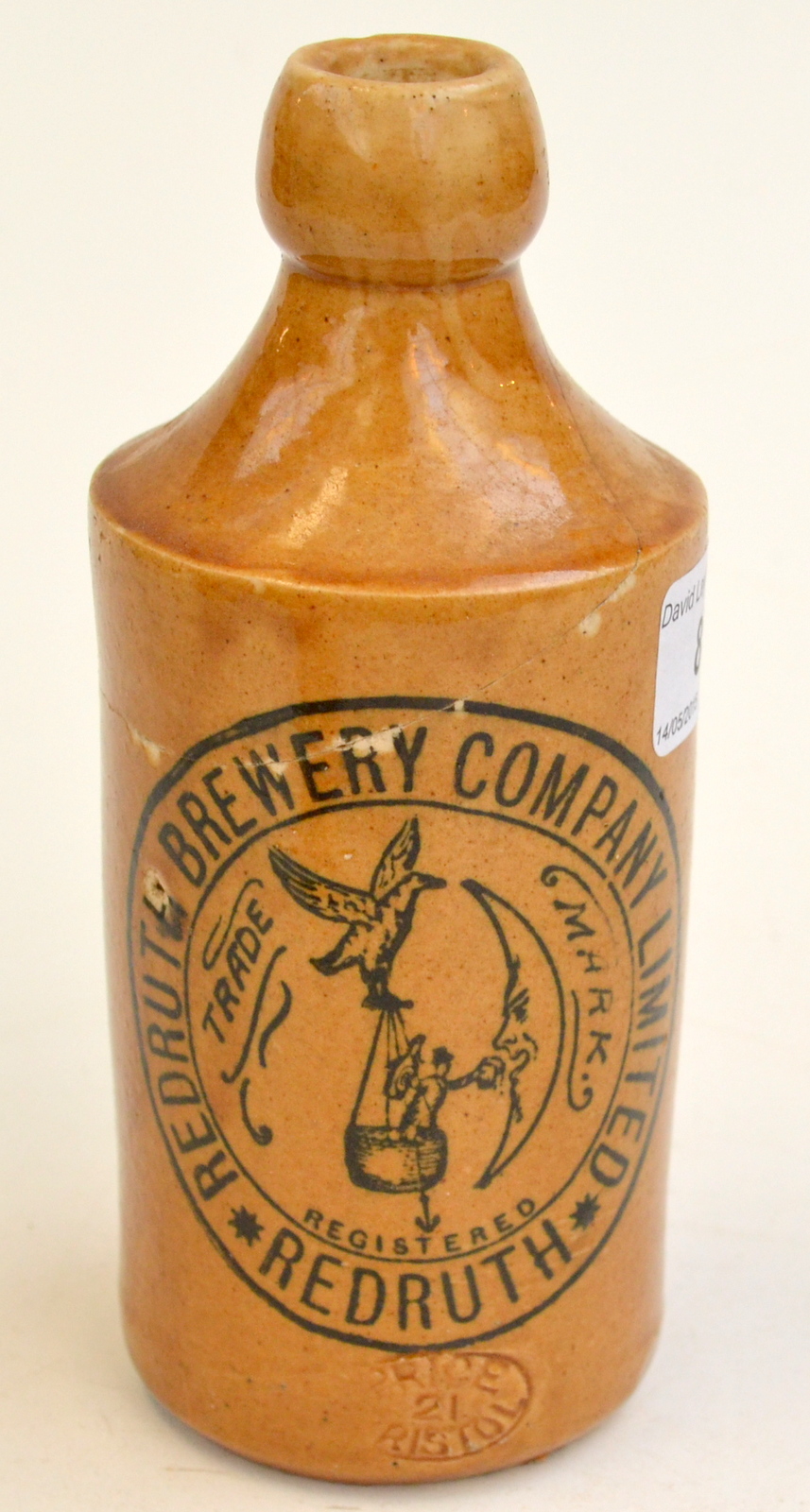 A Redruth Brewery Company Limited stoneware bottle. Condition Report: Cracks.