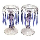 A pair of amethyst cut glass candlestick lustres, height 21cm.  Condition Report: 1920s/1930s , no