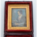 A mid 19th century "Beard Patentee" hand coloured Daguerrotype of a lady reading a book,