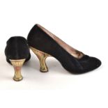 A pair of 1920s black velvet shoes by 'Joseph Box, 45 Conduit Street', the heels celluloid veneered,
