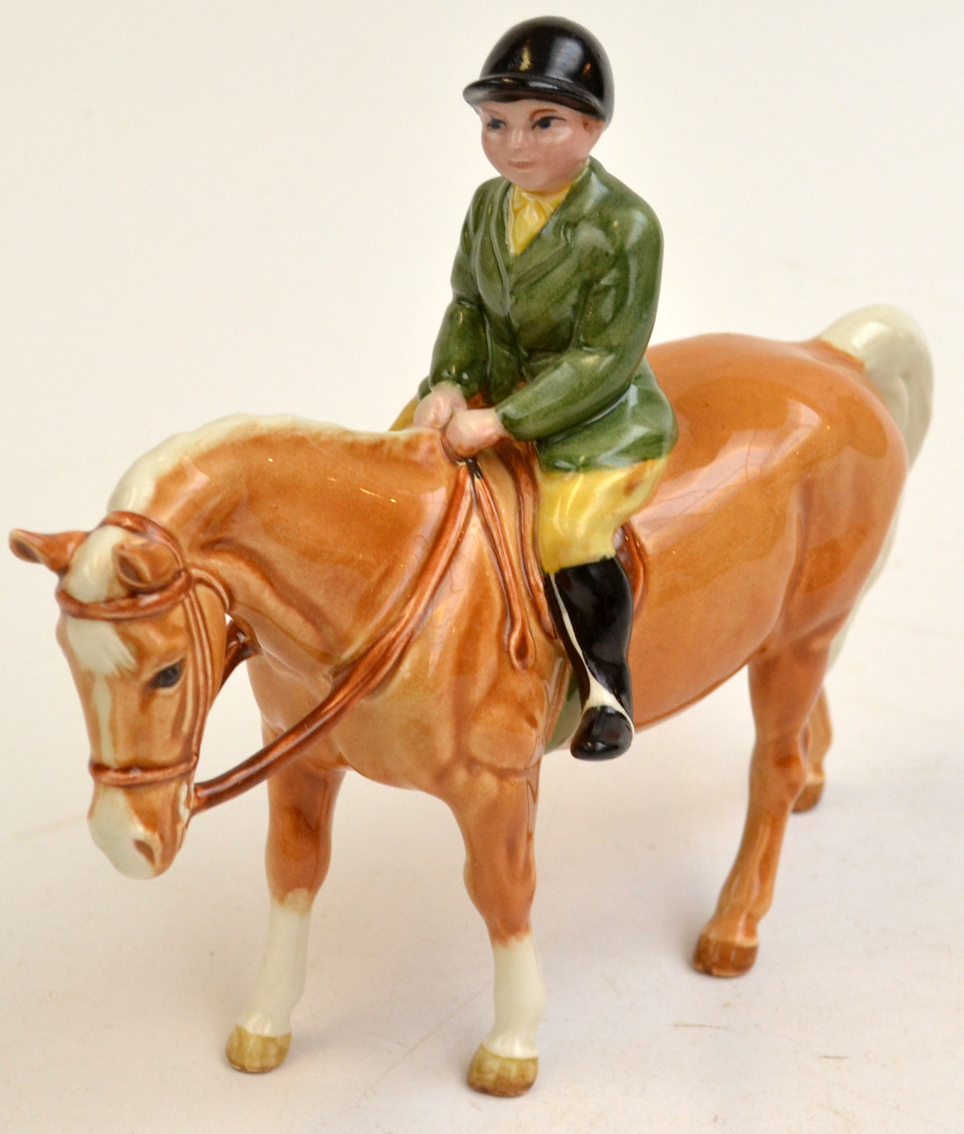 A Beswick boy on a pony.