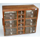 A continental pine chest with glass drawers, width 41.5cm, height 34cm.