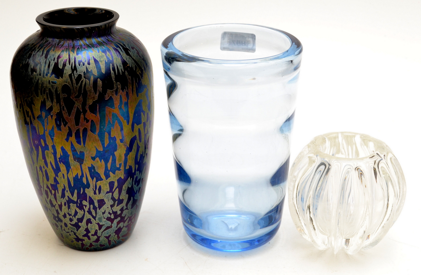 A Whitefriars glass vase, a Brierley studio glass vase and one other glass vase.