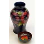 A Moorcroft blue ground "Anemone" pattern baluster vase, height 18cm, together with a Moorcroft