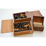 A turned wood chess set in a pine box, together with a Staunton pattern chest set,