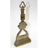 A Victorian brass door stop cast in the manner of the Aesthetic Movement.
 Condition Report: Good