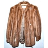 A 'Higg's Furs' short pale mink coat.