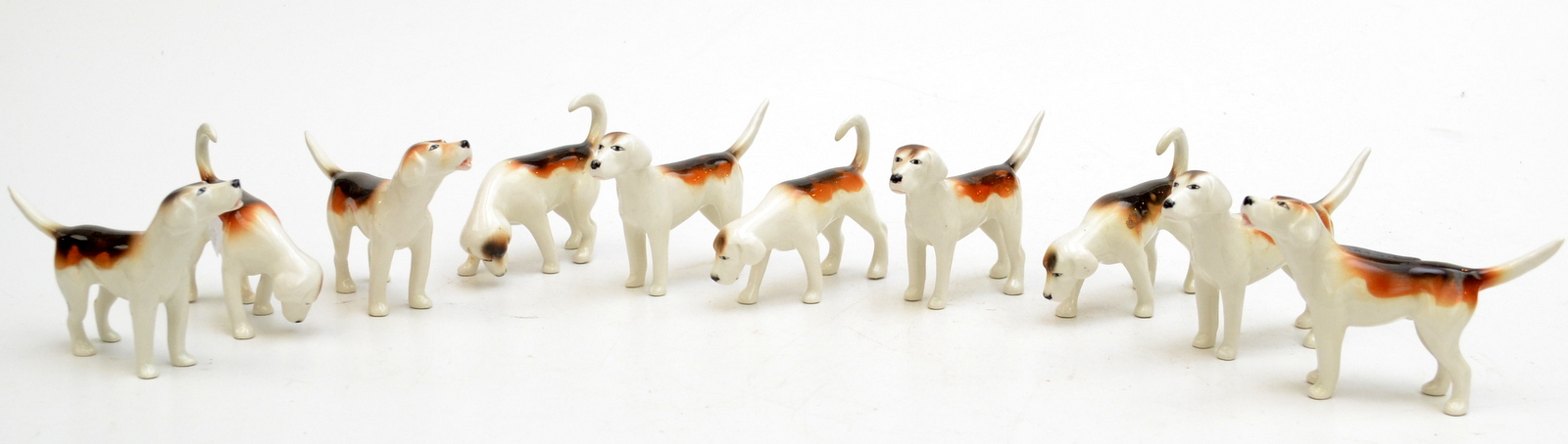 A pack of ten Beswick hounds in various poses. Condition Report: Good condition.