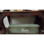 A 19th century mahogany centre table with serpentine sides and convex ends above a carved apron on