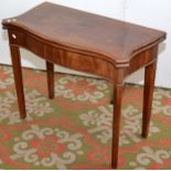 An Chippendale period mahogany serpentine section fold top card table.