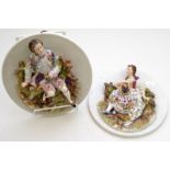 A pair of German porcelain late 19th century, relief moulded circular wall plaques,