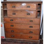 A 19th century campaign chest with two drawers flanked by niches above four longer drawers, all with