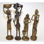 A set of four African cast metal model figures.