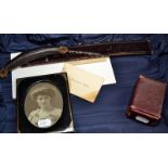 A red leather vanity case containing a set of Patience cards and a photograph frame.