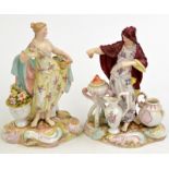 A pair of continental porcelain figures, one representing Winter, the other Summer. Condition