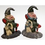 A Victorian iron doorstop, cast as Mr Punch and Toby, height 33cm, together with a later example,