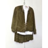 A ladies' dark green suede suit in Austrian style comprising jacket, skirt and white shirt,