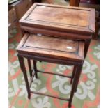 A nest of two Chinese hardwood tables.