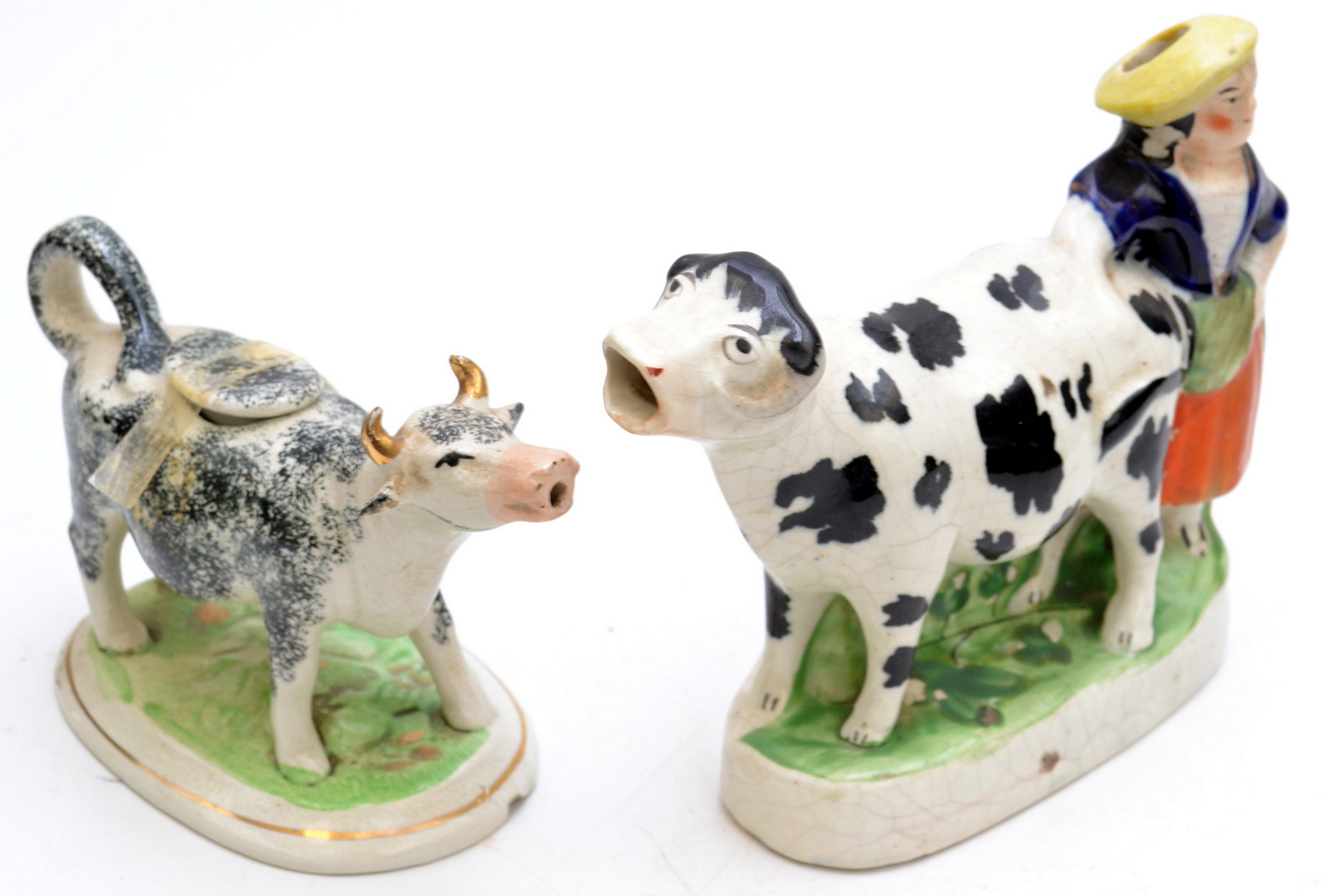 Two cow creamers.