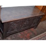 A late 17th century joined oak carved panelled coffer, width 137cm.