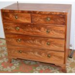 A mahogany straight front chest of two short and three long graduated cock beaded drawers.