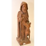 A French carving of St. Herve, signed with a T.M. monogramme, height 43cm.