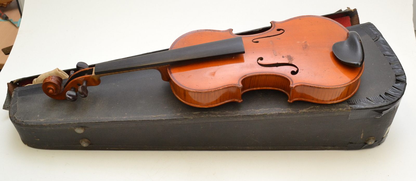 An early 20th century Hawkes & Son violin, labelled "Hawkes & Son Tyrolese Violin", Denham Street,