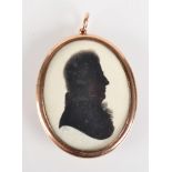 A George III John Miers silhouette of a gentleman in gold pendant mount, the back with woven hair