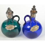 A green glass flask and a matching blue glass flask, each with engraved, silver plated mounts,